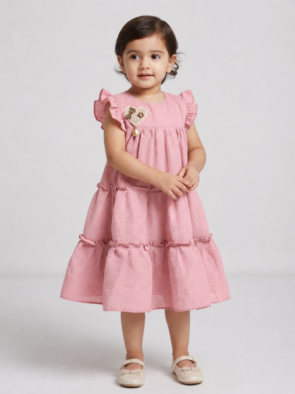 Girls Pink Tiered Dress with Ruffled Sleeves and Heart Embellishment - Knee Length